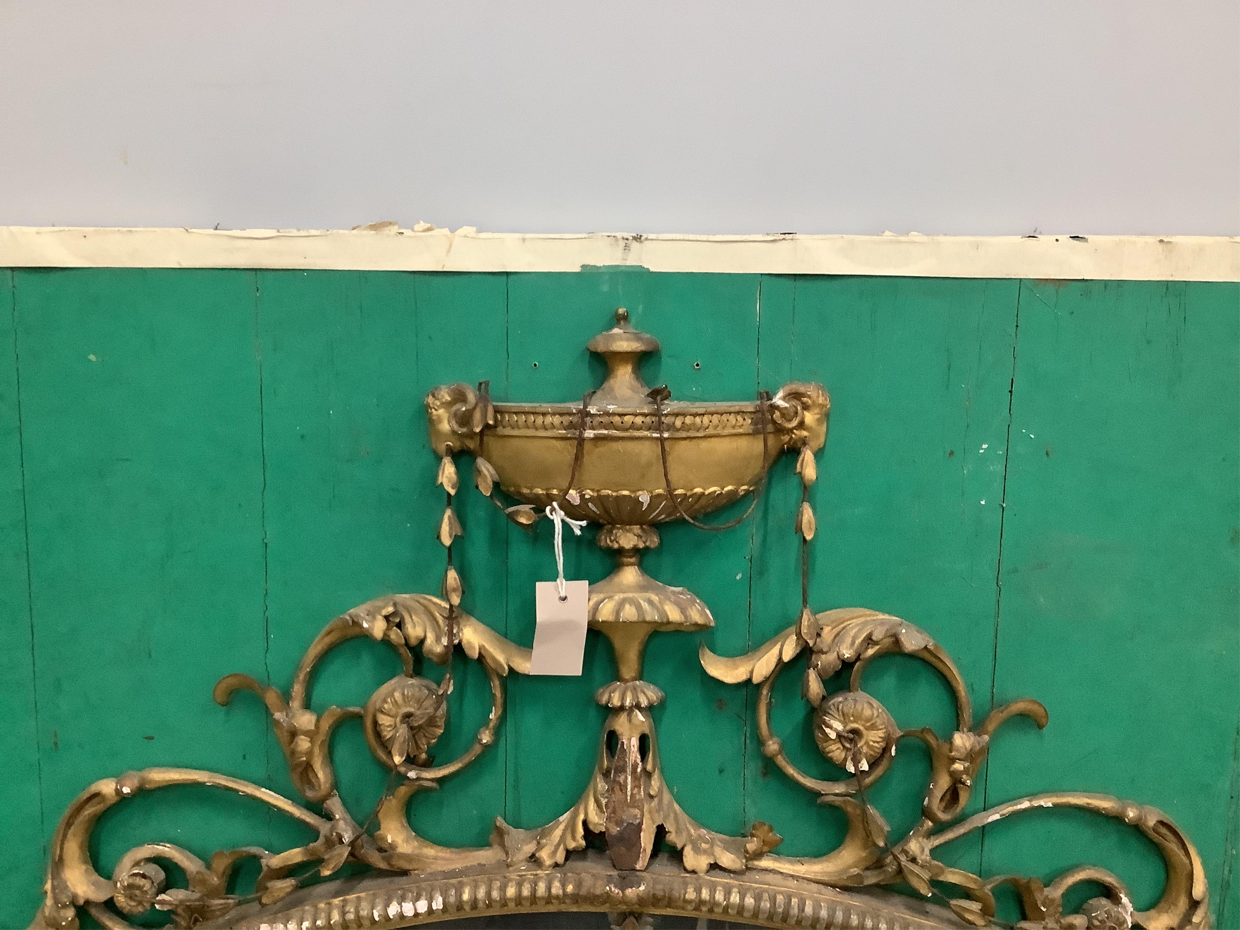 A Victorian oval giltwood and composition wall mirror, width 152cm, height 157cm. Condition - poor to fair